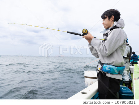 A man enjoying sea fishing 107906821
