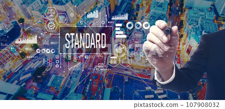 Standard theme with businessman in city at night Standard theme with businessman in city at night 107908032