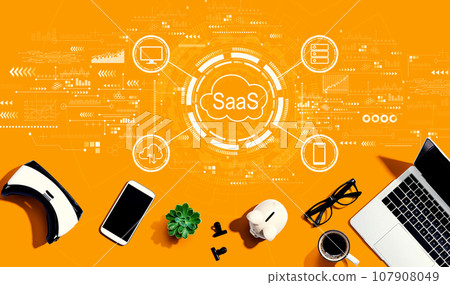 SaaS - software as a service concept with electronic gadgets and office supplies 107908049