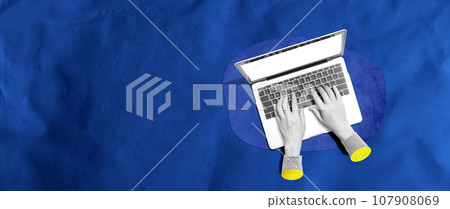 Person using a laptop computer 107908069