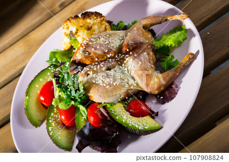 Quail Tabaka with sesame Quail Tabaka with sesame 107908824
