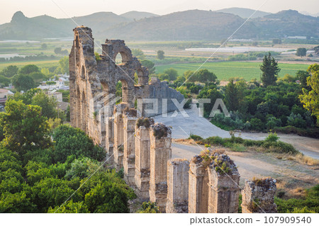 Aspendos Ancient City. Aspendos acropolis city ruins, cisterns, aqueducts and old temple. Aspendos Antalya Turkey. turkiye Aspendos Ancient City. Aspendos acropolis city ruins, cisterns, aqueducts and old temple. Aspendos Antalya Turkey. turkiye 107909540