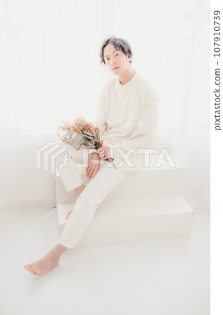 man with dried flowers man with dried flowers 107910739