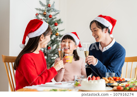 young family at christmas young family at christmas 107916274