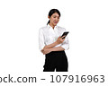 A woman in a suit looking at her cell phone. 107916963