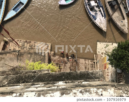 A person bathes in the Ganges River in Varanasi, India. A person bathes in the Ganges River in Varanasi, India. 107916979