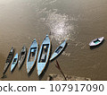 A blue rowboat floating on the Ganges River in Varanasi, India. 107917090
