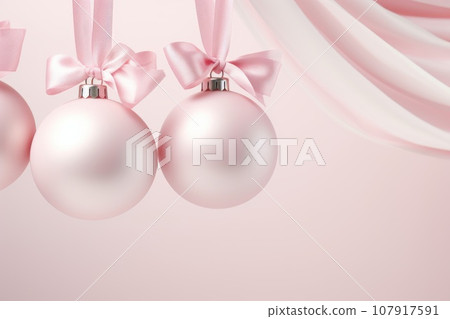 Pink Christmas balls on a satin ribbon Pink Christmas balls on a satin ribbon 107917591