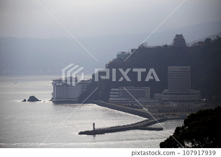 Silhouette of hotels and pier along the coast Silhouette of hotels and pier along the coast 107917939