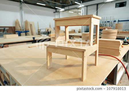 Manufactured small wooden ladder in a woodwork studio Manufactured small wooden ladder in a woodwork studio 107918013