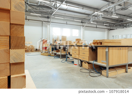Interior of large workshop of contemporary furniture factory Interior of large workshop of contemporary furniture factory 107918014