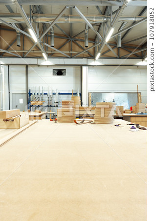 Interior of large workshop of contemporary furniture factory Interior of large workshop of contemporary furniture factory 107918052