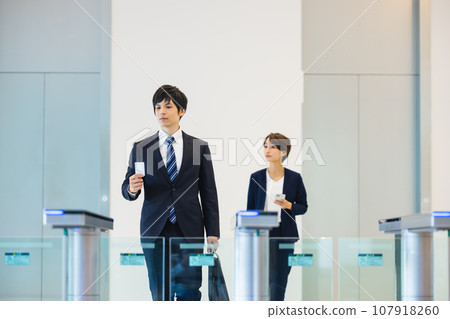 Businessman passing through the security gate Photography cooperation: LINK FOREST Businessman passing through the security gate Photography cooperation: LINK FOREST 107918260