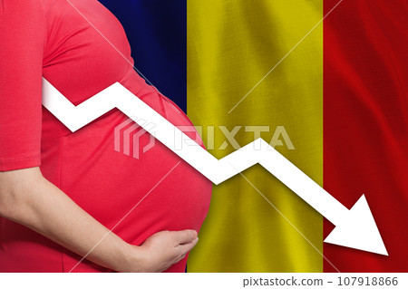 Romanian pregnant woman on flag of Romania background. Falling fertility rate 107918866