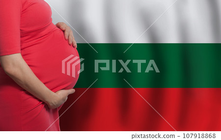 Bulgarian pregnant woman belly on flag of Bulgaria background Bulgarian pregnant woman belly on flag of Bulgaria background 107918868