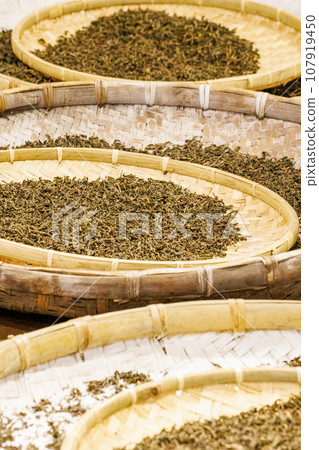 Tea leaves being exposed to the sun 107919450