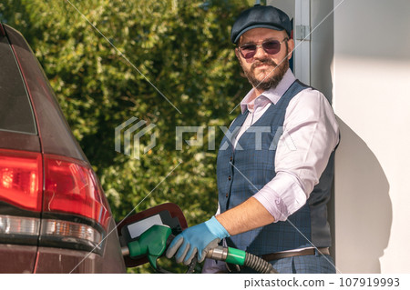 charismatic man with beard and sunglasses in suit fills charismatic man with beard and sunglasses in suit fills 107919993