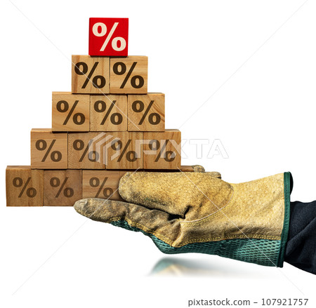 Gloved Hand Holding Wood Blocks with Percentage Signs Isolated on White 107921757