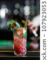 Desirable Alcoholic and Non-Alcoholic Cocktails on the Bar Counter, Adorned with Colorful, Natural, and Healthy Ingredients and Fruit Garnishes 107923053