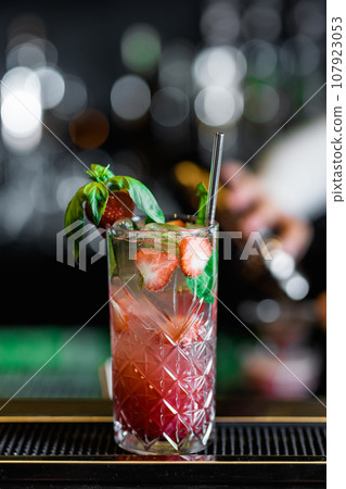 Desirable Alcoholic and Non-Alcoholic Cocktails on the Bar Counter, Adorned with Colorful, Natural, and Healthy Ingredients and Fruit Garnishes 107923053