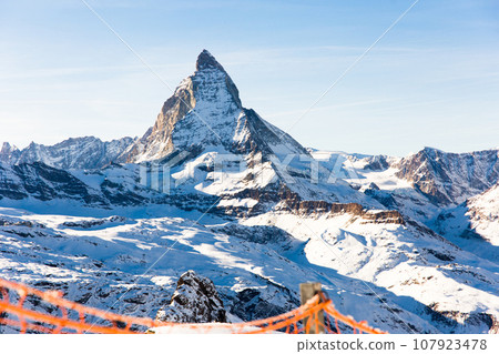 Snowy mountain Matterhorn during the day in winter. Zermatt, swiss alps Snowy mountain Matterhorn during the day in winter. Zermatt, swiss alps 107923478