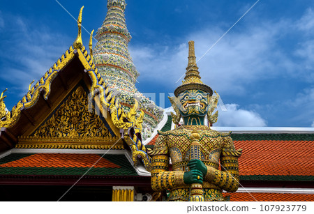 Giant statue in the Temple of the Emerald Buddha. Giant statue in the Temple of the Emerald Buddha. 107923779