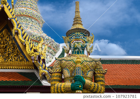 Giant statue in the Temple of the Emerald Buddha. Giant statue in the Temple of the Emerald Buddha. 107923781