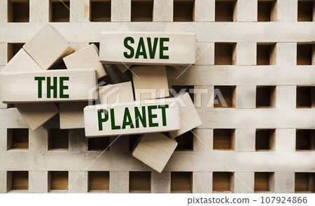 The concept of globalization. On the wooden blocks is written - Save the planet. The concept of globalization. On the wooden blocks is written - Save the planet. 107924866