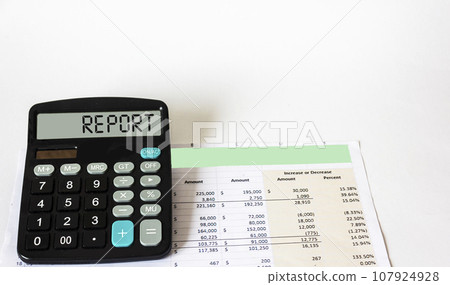 The word REPORT is written on a calculator display that lies on financial documents The word REPORT is written on a calculator display that lies on financial documents 107924928