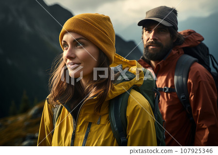 Group of young people climb the mountains along a mountain path. Group of young people climb the mountains along a mountain path. 107925346
