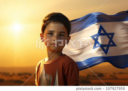Israeli flag behind little boy at sunset 107927950