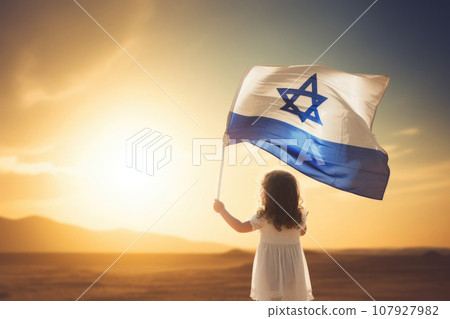 Israeli flag with a star of David in little girl's hands 107927982