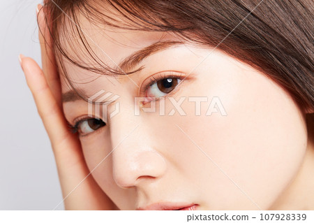 Beauty young Japanese woman eyes close-up Beauty young Japanese woman eyes close-up 107928339