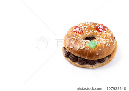 Individual Epiphany cake roscon de reyes isolated on white background Individual Epiphany cake roscon de reyes isolated on white background 107928848