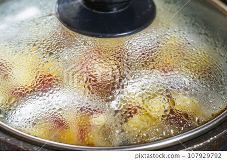 Oni manju steamed in a frying pan Oni manju steamed in a frying pan 107929792