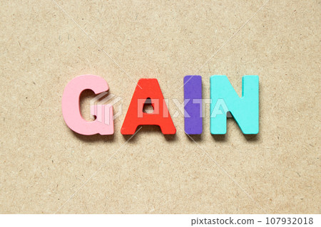 Color alphabet letter in word gain on wood background 107932018