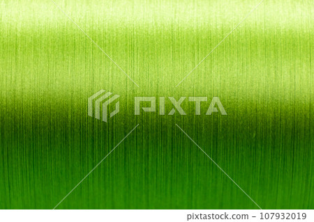 Closed up of green color of thread textured background (Focus at center of picture) 107932019