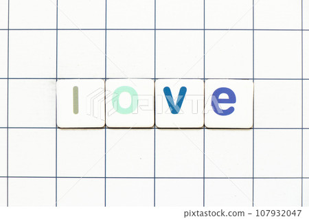 Colorful tile letter in word love on white grid background 107932047
