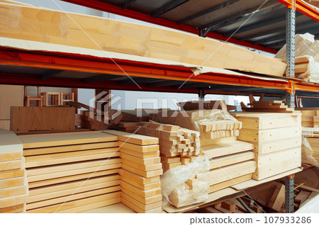 Stacked wooden bars in workshop of furniture manufacture 107933286