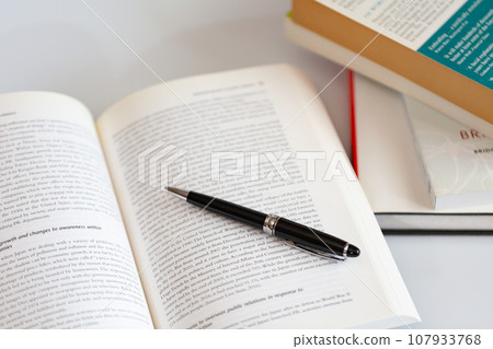 English books and pens opened on the desk Image of research and learning 107933768