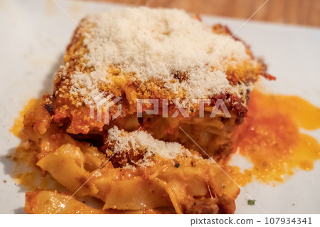 Lasagna served on plate on the table 107934341