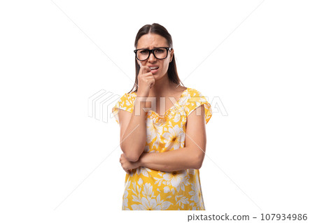 portrait of a slender young woman with glasses for vision correction on a white background portrait of a slender young woman with glasses for vision correction on a white background 107934986