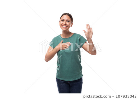 charming cute friendly slim young brunette woman dressed in a green t-shirt smiling on a white charming cute friendly slim young brunette woman dressed in a green t-shirt smiling on a white 107935042