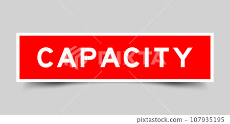 Red color square label sticker with word capacity on gray background 107935195