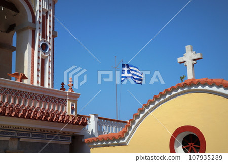 The monastery Panormitis is a large Venetian styled building with one of the highest baroque bell-towers in the world. Symi Island, Greece 107935289