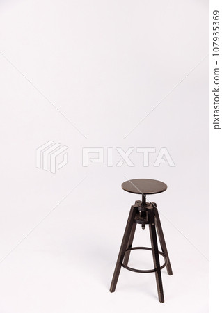 Vintage wooden stool on white background Vintage wooden stool on white background 107935369