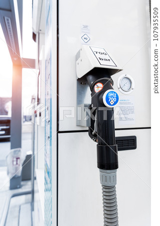 Close-up detail view of hydrogen fuel filler nozzle nozzle adapter car H2 gas filling station in Germany. Refueling vehicle with renewable innovative zero emission product. Future safety technology 107935509