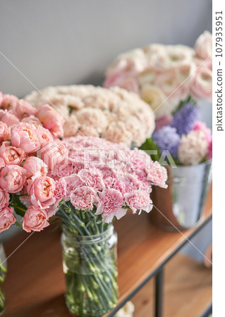 Many different flowers on Showcase. Background of mix of flowers. Beautiful flowers for catalog or online store. Floral shop and delivery concept. Many different flowers on Showcase. Background of mix of flowers. Beautiful flowers for catalog or online store. Floral shop and delivery concept. 107935951