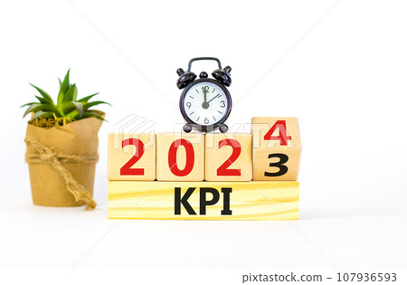 KPI, key performance indicator symbol. Businessman turns wooden cubes with words KPI 2023 and KPI 2024 on beautiful white background, copy space. Business KPI key performance indicator concept. 107936593