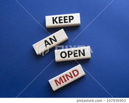 Keep an open mind symbol. Wooden blocks with words Keep an open mind. Beautiful grey green background. Business and Keep an open mind concept. Copy space. 107936903